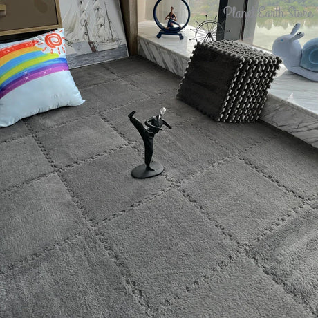 Gray carpet with a decorative figure on a textured surface