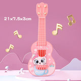 Pink toy guitar with cartoon cat design on a pink background with musical notes.
