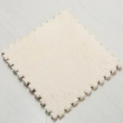 Square pillow with pom-pom trim on a light gray background
