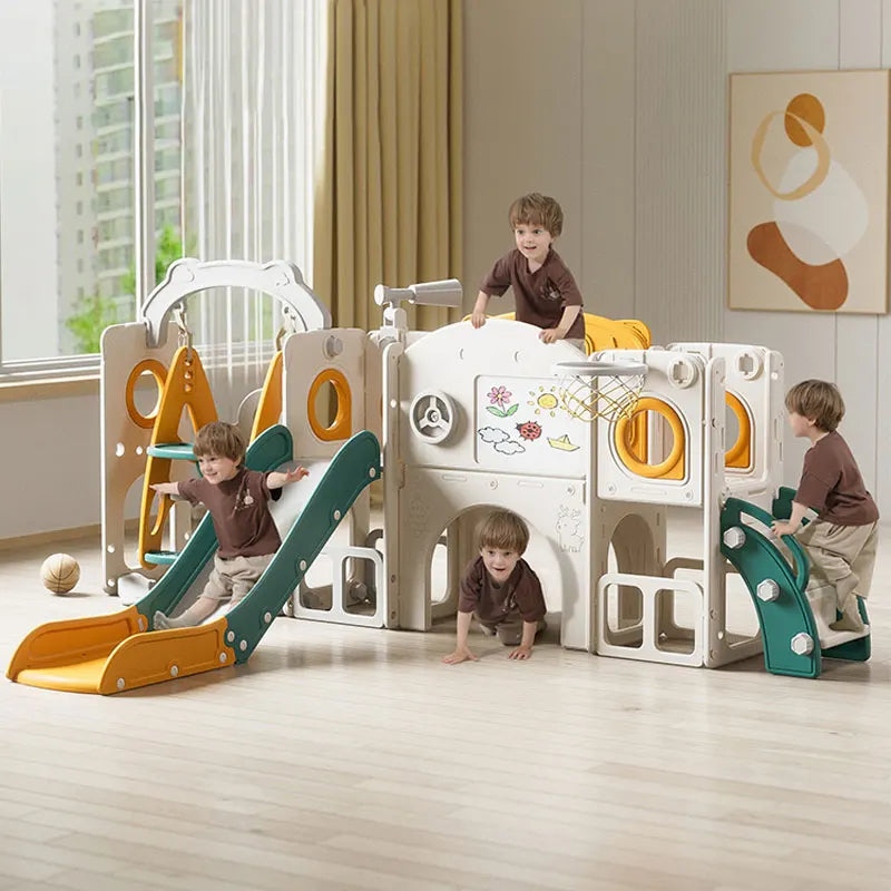 Children playing with a colorful play structure in a room with large windows.