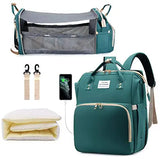 Collection of baby care products including a teal backpack, crib, and accessories on a white background.