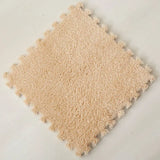 Beige interlocking foam rug tile on a light gray background