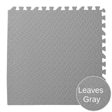 Gray interlocking foam mat with textured pattern on a white background