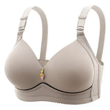 Beige bra with decorative clasp on a white background