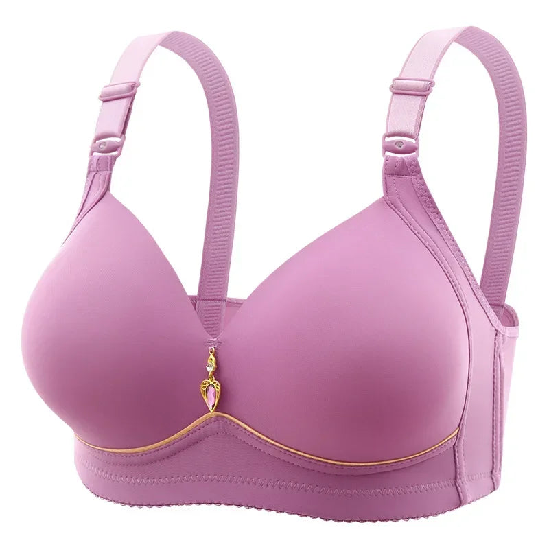 Pink bra with decorative trim on a white background