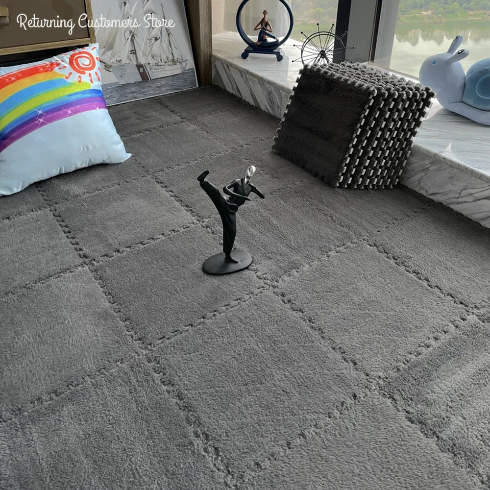 Gray carpet with decorative items including a rainbow pillow and a small statue.