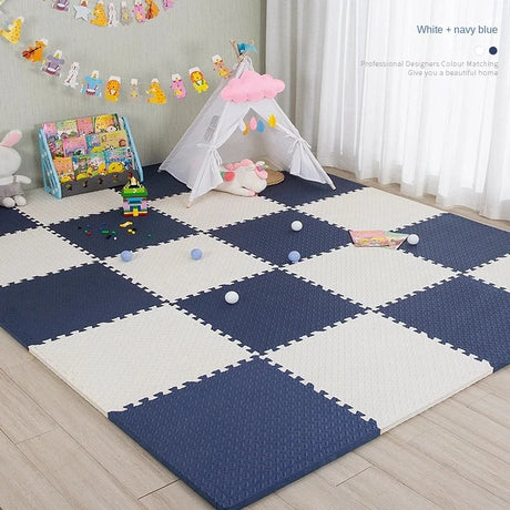 Children's play area with a navy and white foam mat, toys, and a small tent.