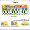 Children's toy piano mat with colorful design and keyboard layout on a white background.