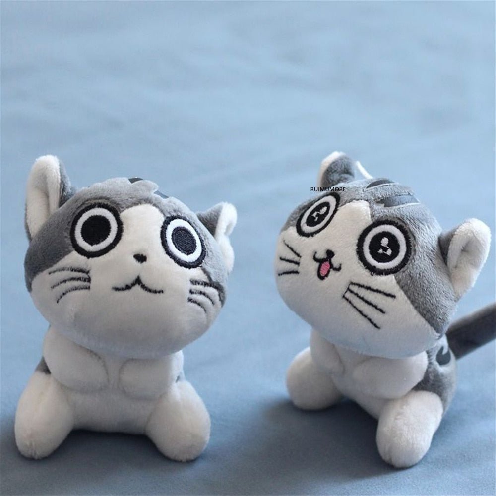 Two plush toys resembling cartoon cats