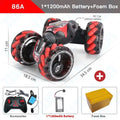 Toy car with red and black design, battery, controller, and foam box.