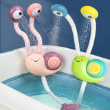 Colorful snail-shaped bath toys with water nozzles in a bathtub.
