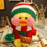 Plush toy duck wearing a knitted hat and scarf on a table with decorative items.