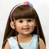 Doll with braided hair and a colorful headband.