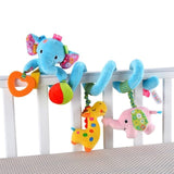 Colorful baby crib mobile with elephant and dinosaur toys on a white crib.