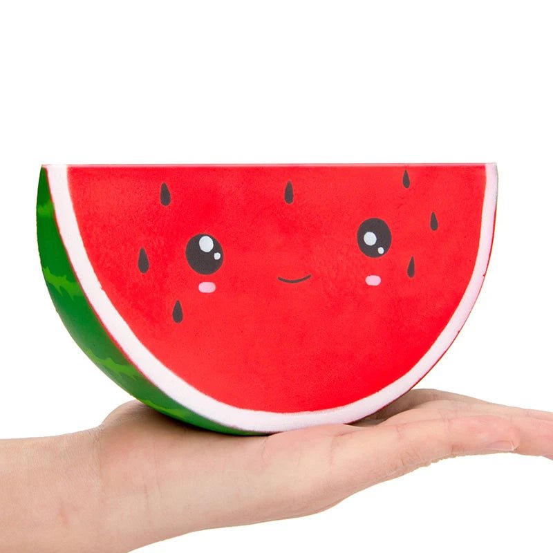 Squishmallow Watermelon plush toy held in a hand on a white background