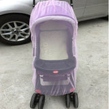 Purple baby stroller with a cover on a concrete surface.