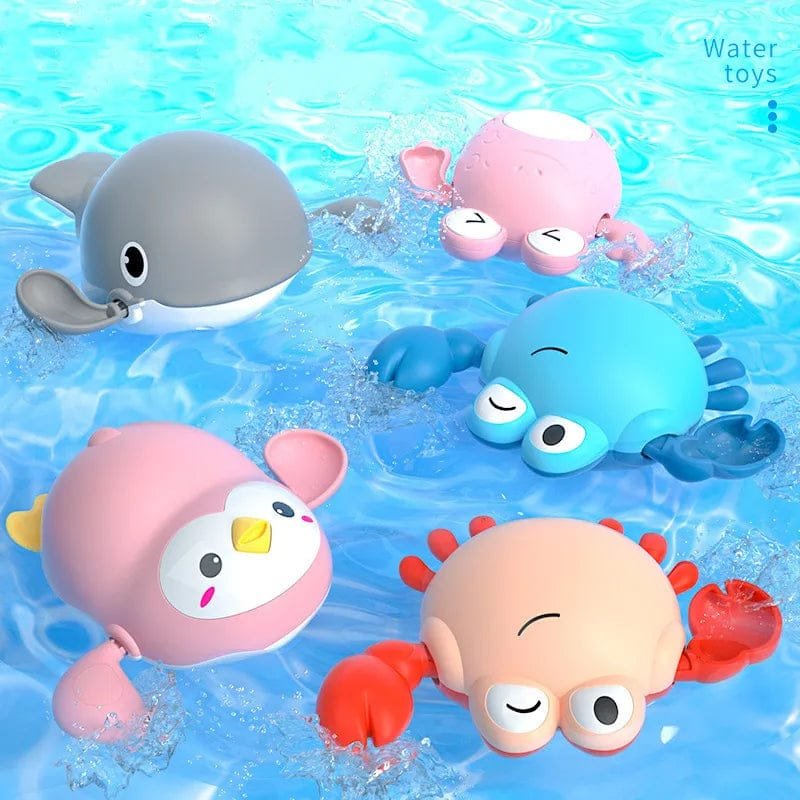 Set of colorful rubber duck toys in water.