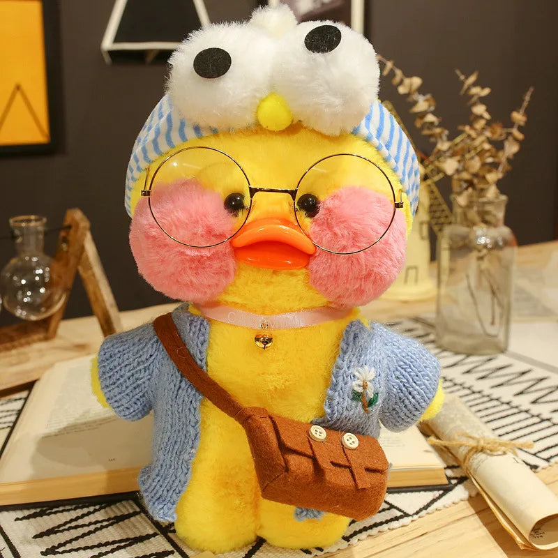 Plush toy duck with glasses and a backpack on a decorative surface