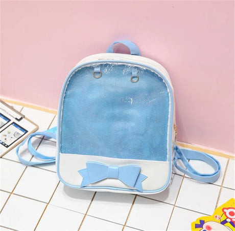 Small blue backpack with a bow