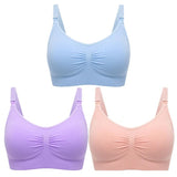Three bras in blue, purple, and pink on a white background