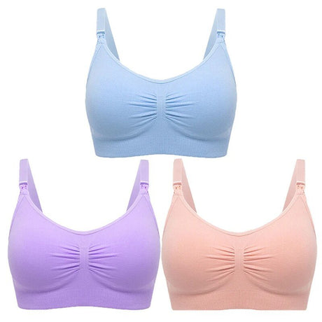 Three bras in blue, purple, and pink on a white background