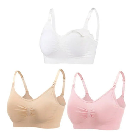 Three bras in white, beige, and pink on a white background
