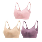 Three wireless bras in pink, beige, and purple on a white background