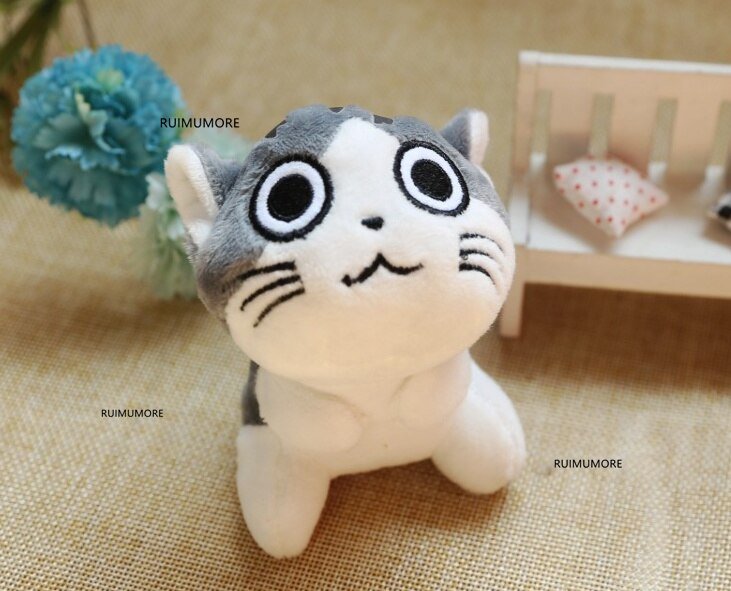 Plush toy cat with large eyes