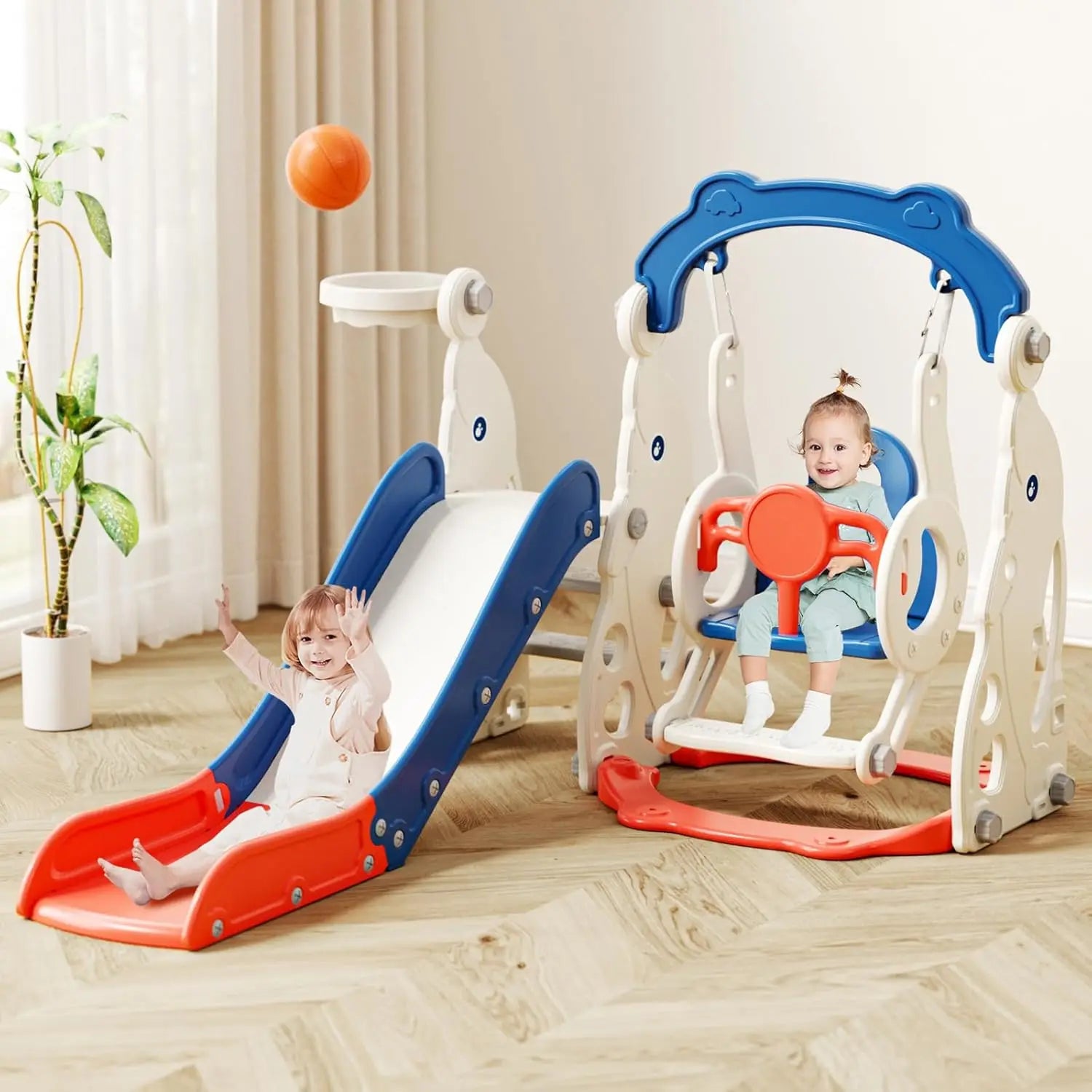 Children's playset with slide and swing in a room with curtains and plant.