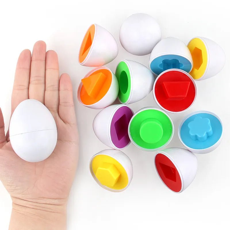 Colorful plastic eggs with various shapes on a white background, one held in a hand for size comparison.