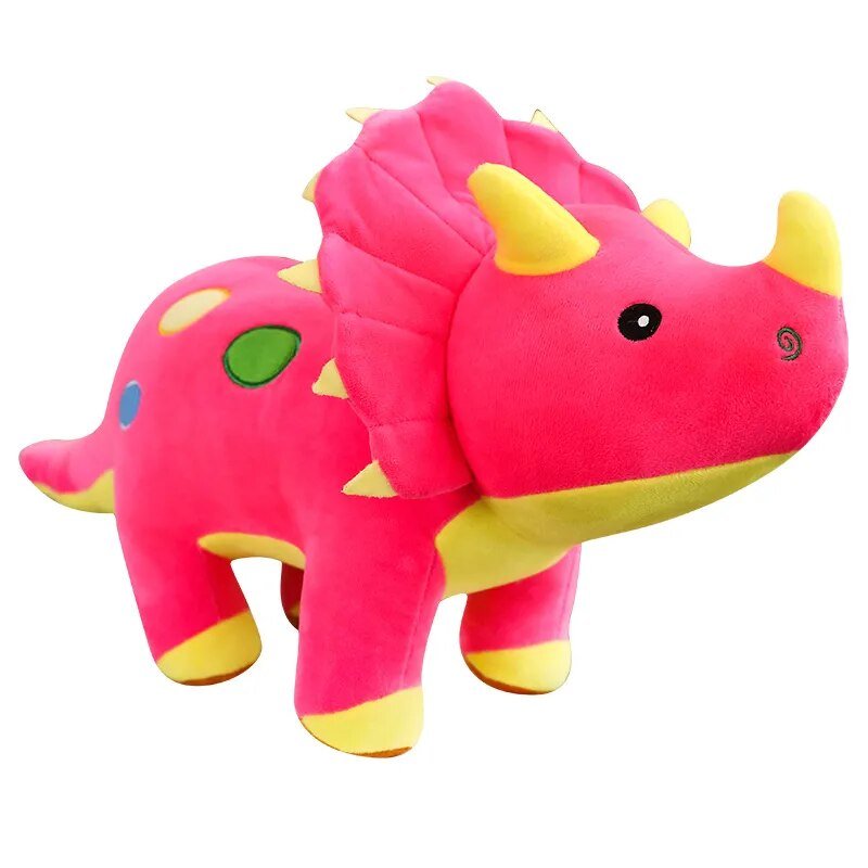 Pink and yellow plush toy dinosaur on a white background