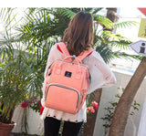 Person wearing a pink backpack