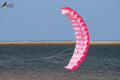 Pink and white kite flying.