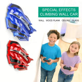 Toy cars designed to climb walls with children playing nearby.