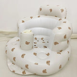 White inflatable baby seat with teddy bear pattern on a white background