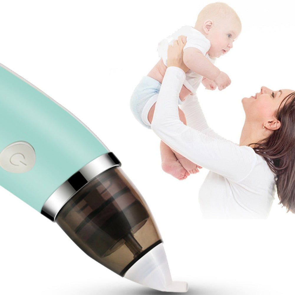 Woman holding a baby next to a teal and black vacuum cleaner on a white background