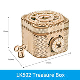 Wooden mechanical treasure box with key.