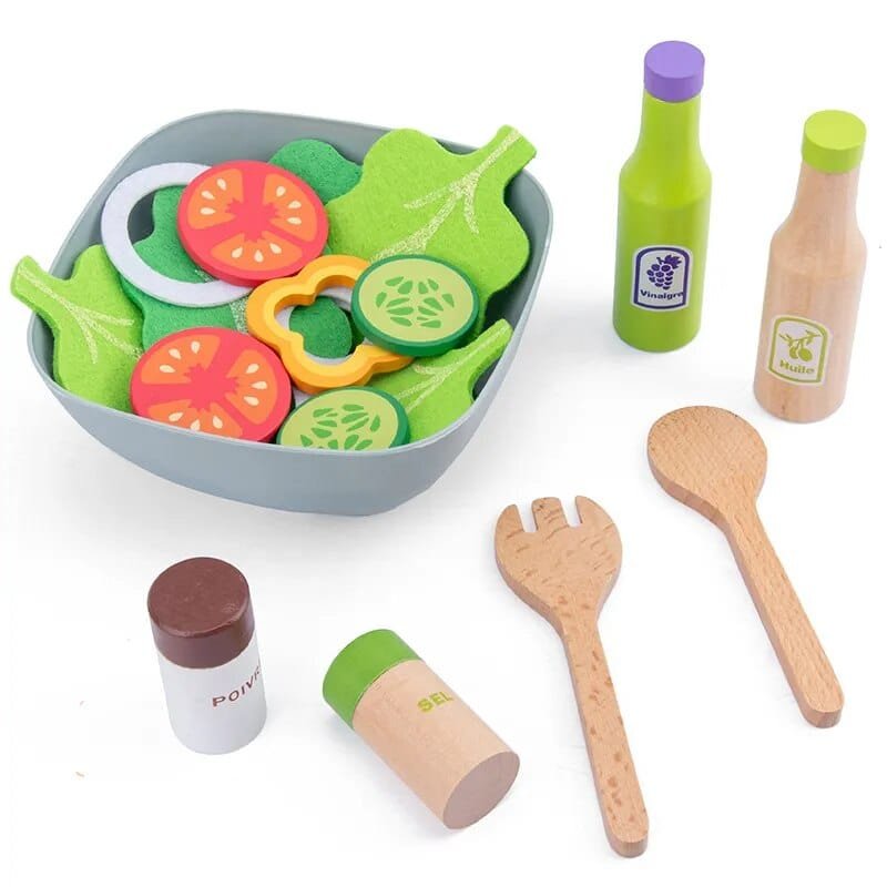 Toy kitchen set with vegetables, bottles, and utensils 