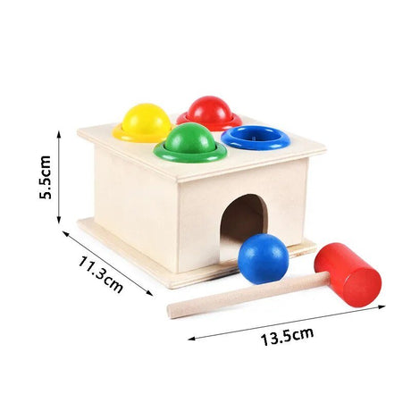 Wooden toy with colorful balls and a mallet, showing dimensions.