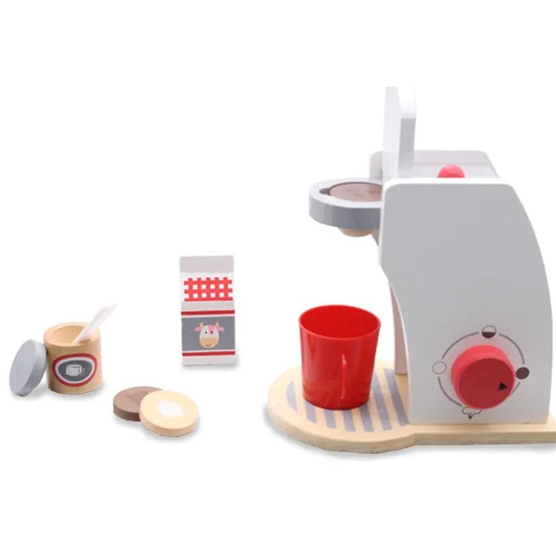 Wooden toy coffee set with a white coffee machine, red cup, and other accessories