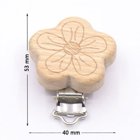 Wooden flower-shaped clip with metal clasp and measurements on a white background