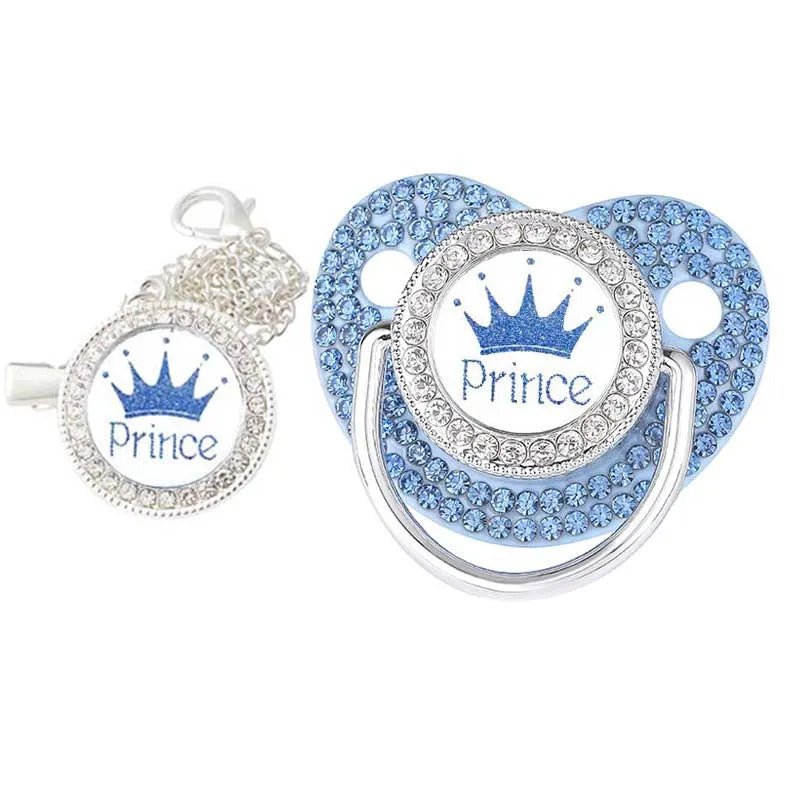 Decorative pacifier with 'Prince' text and crown design on a white background
