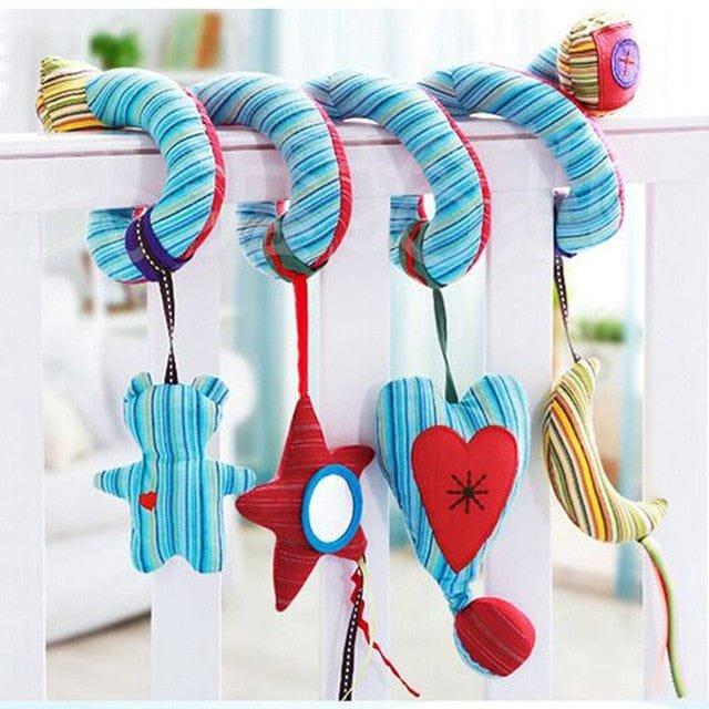Colorful baby mobile with starfish, heart, and cloud shapes hanging from a crib.