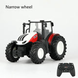 Toy tractor with narrow wheels and a remote control on a white background