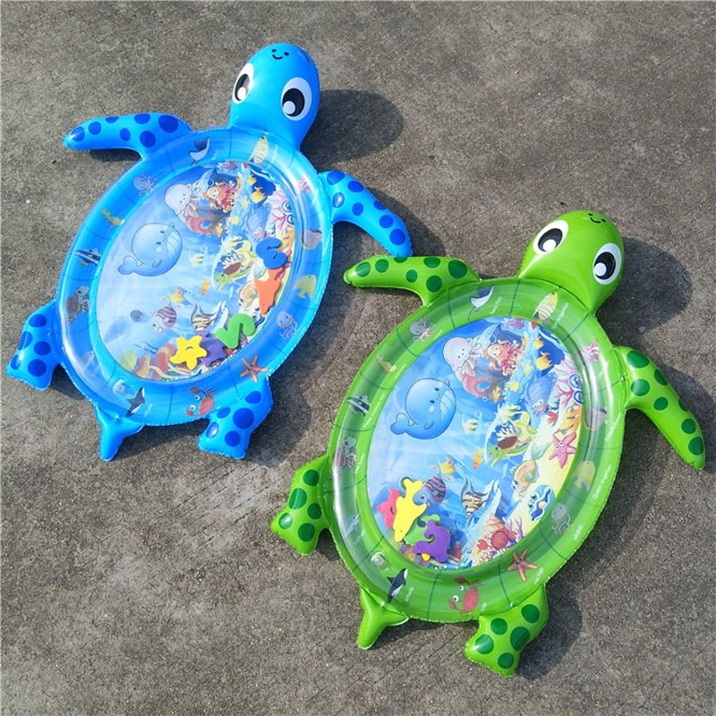 Two inflatable turtle toys with water play areas on a concrete surface.
