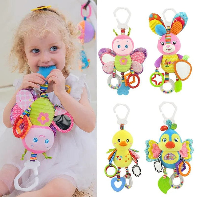 Child holding a colorful baby teether with butterfly design, surrounded by similar toys on a white background.