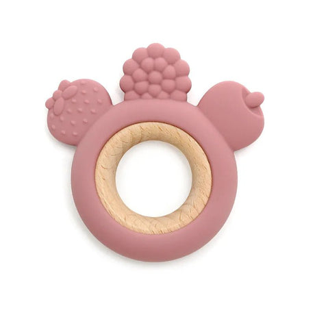 Pink silicone teething ring with textured surface on a white background