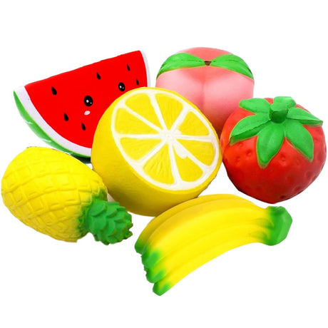 Set of colorful fruit-shaped squishies on a white background