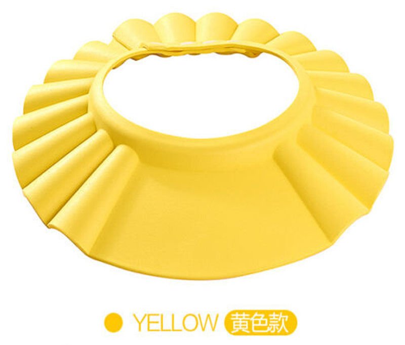 Yellow adjustable baby bath shampoo cap that shields eyes and ears while washing hair in the tub or shower.