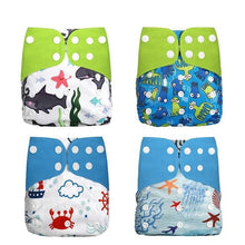 Four colorful children's swim diapers with animal and sea-themed prints 